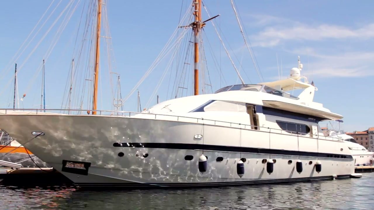 Illustrative yacht anchored in the port