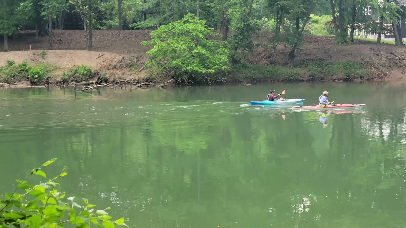Illustrative kayaking experience on a green river